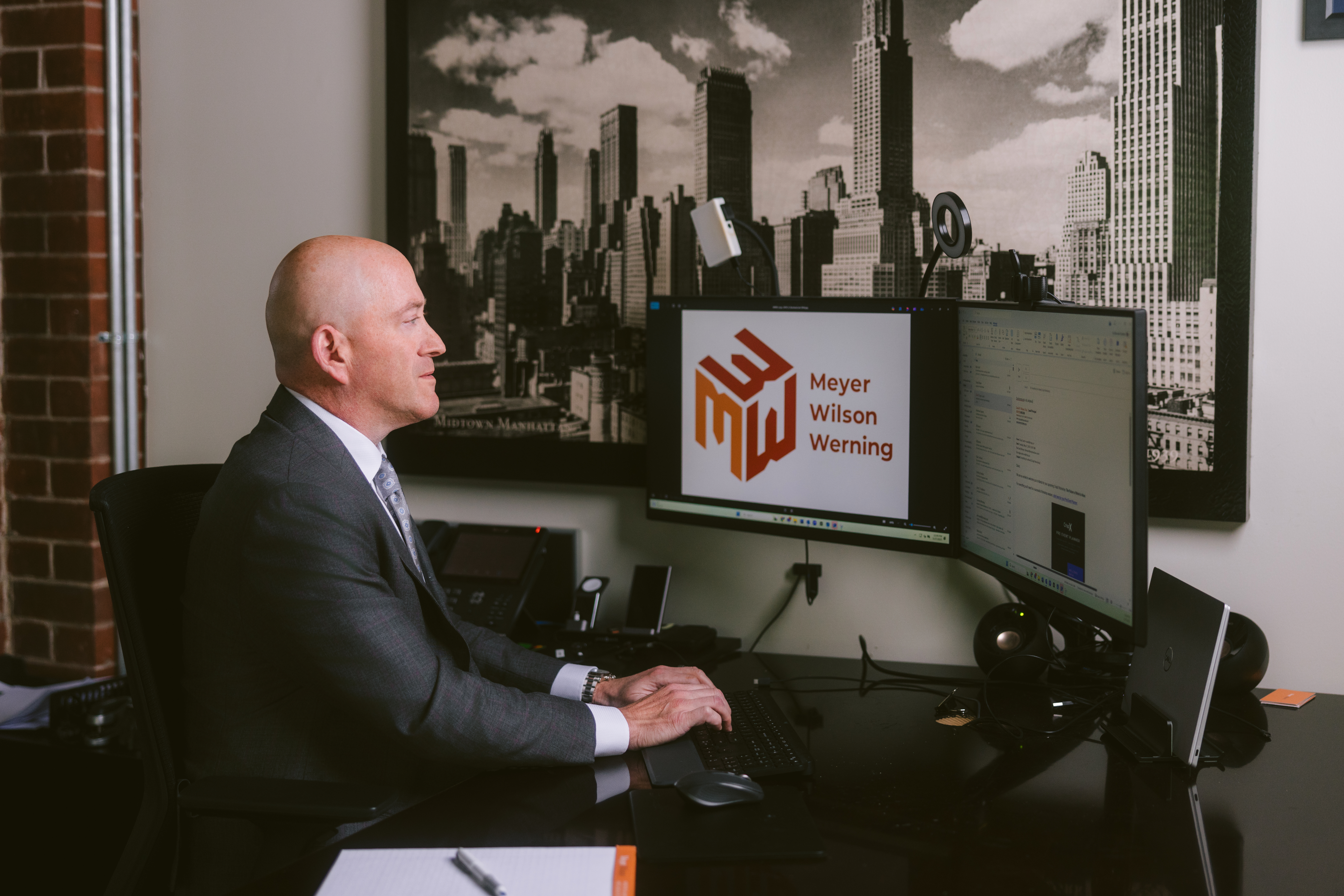 David P. Meyer, founding partner and managing principal of Meyer Wilson Werning, working at his desk at the firm's Columbus, Ohio office.
